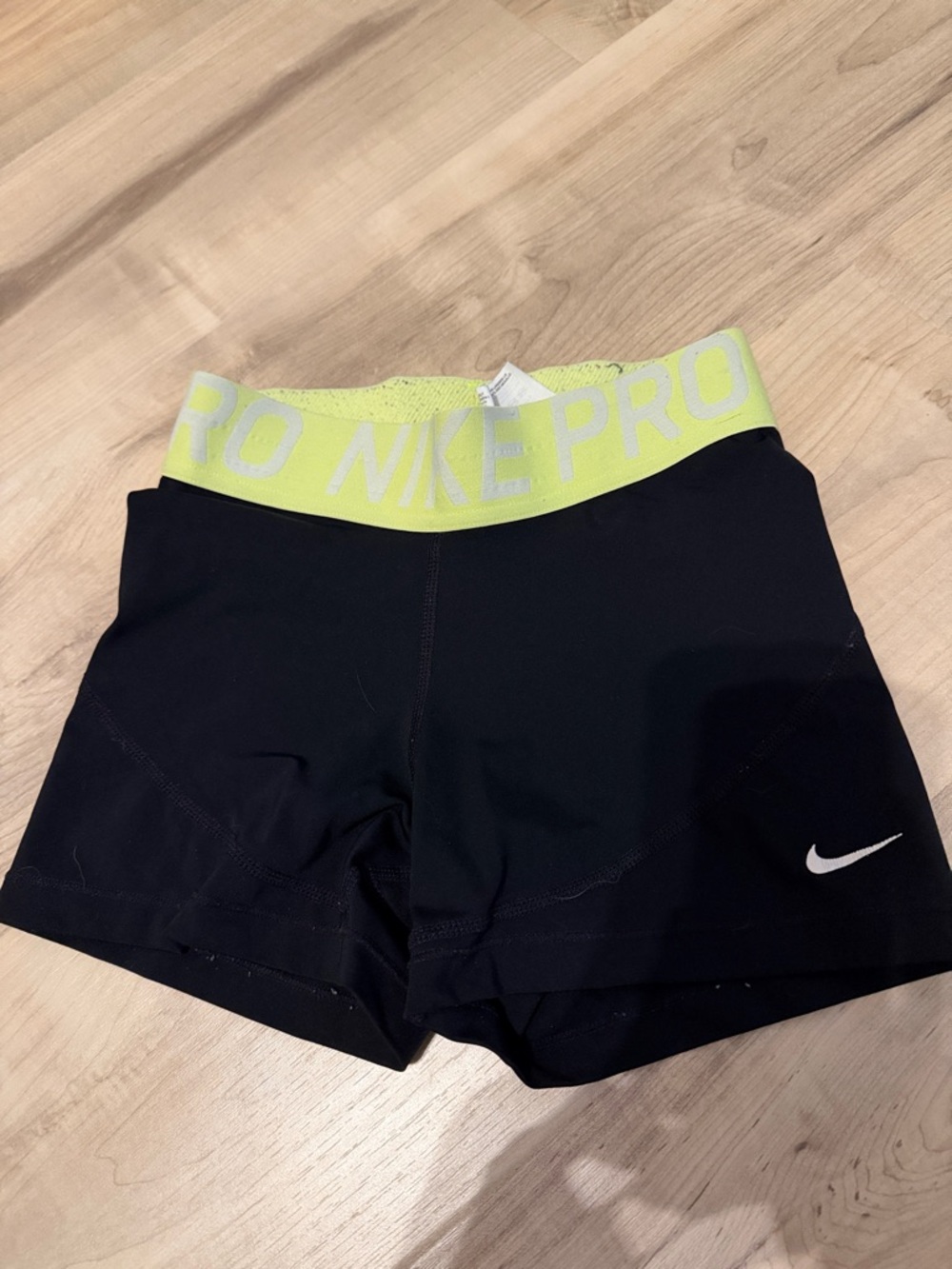 size small black and neon yellow dri-fit nike pros